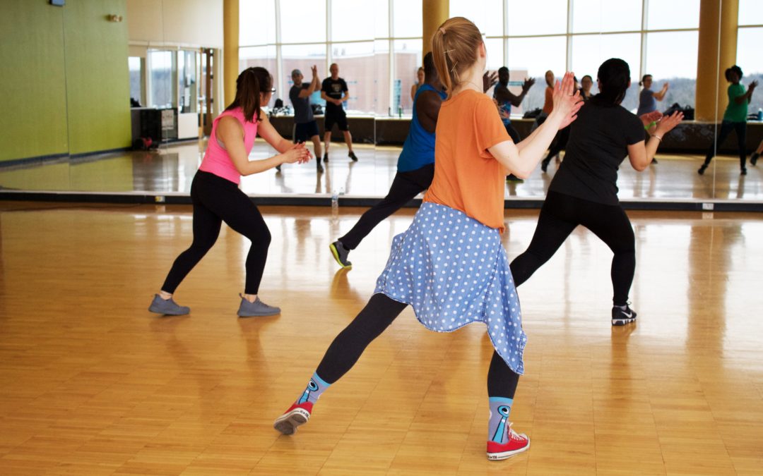 women dancing near mirror